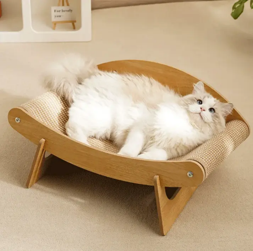 Wooden cat scratching post lounge with curved design, featuring a fluffy white cat resting on a raised wooden bed